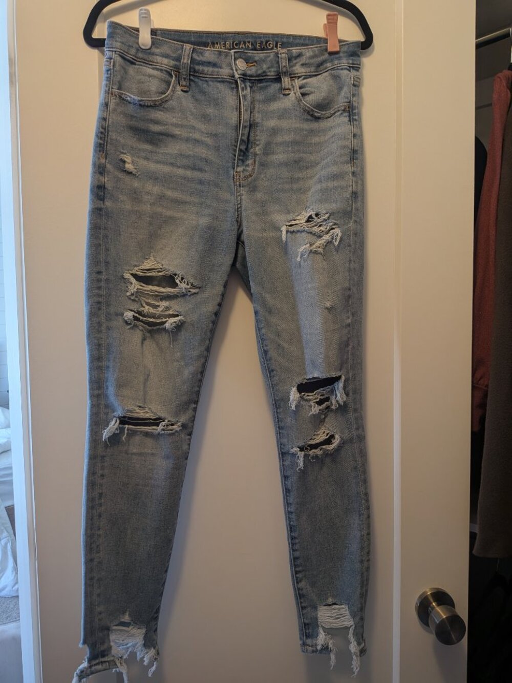Light blue AE High-Waisted "next-level stretch" Ripped Jegging - size 10